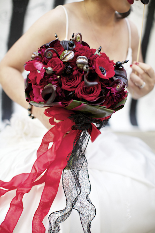 red bouquet of flowers - wedding photo by top Orange County, California wedding photographers D. Park Photography